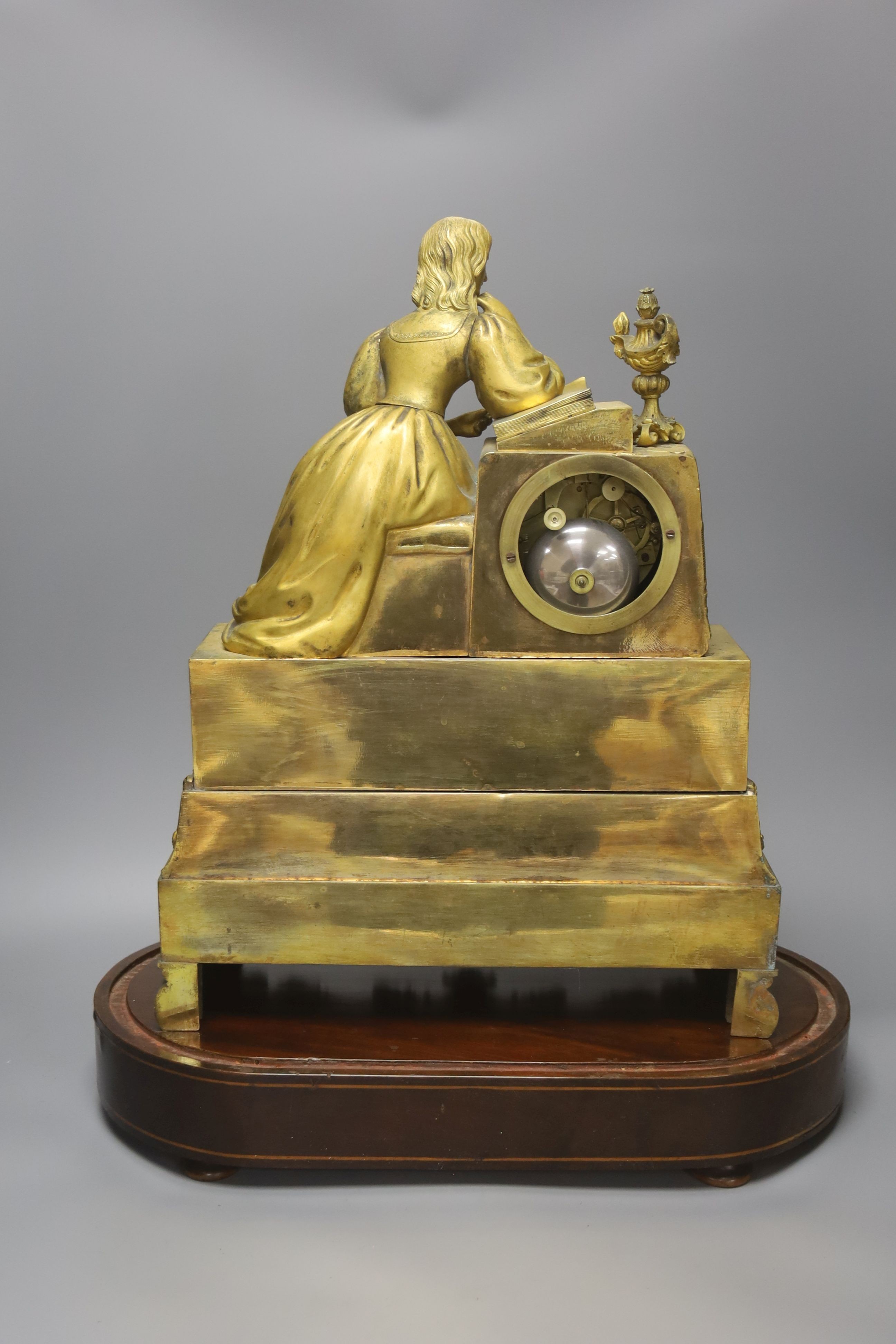 A 19th century French ormolu mantel clock (lacking pendulum), under glass dome and marquetry inlaid stand 54cm